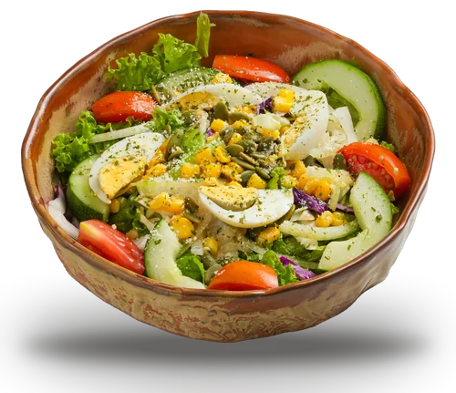 Garden salad with boiled egg, tomato, cucumber, sweetcorn and pumpkin seeds in a rustic ceramic bowl