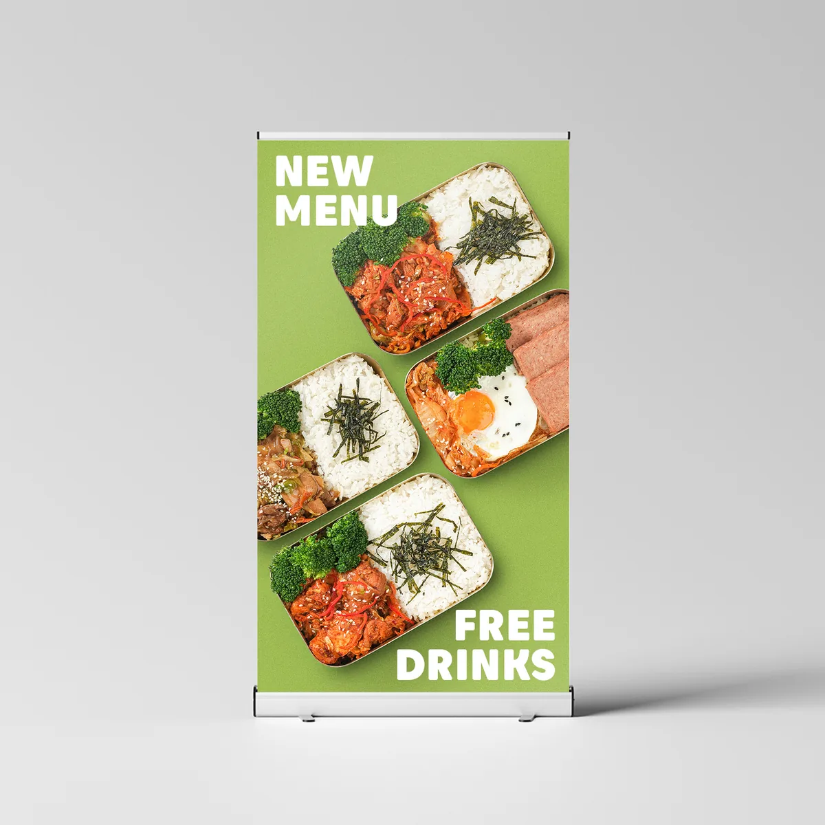 Roll-up banner design announcing a new bento menu with free drinks, using four bento trays on a green ground